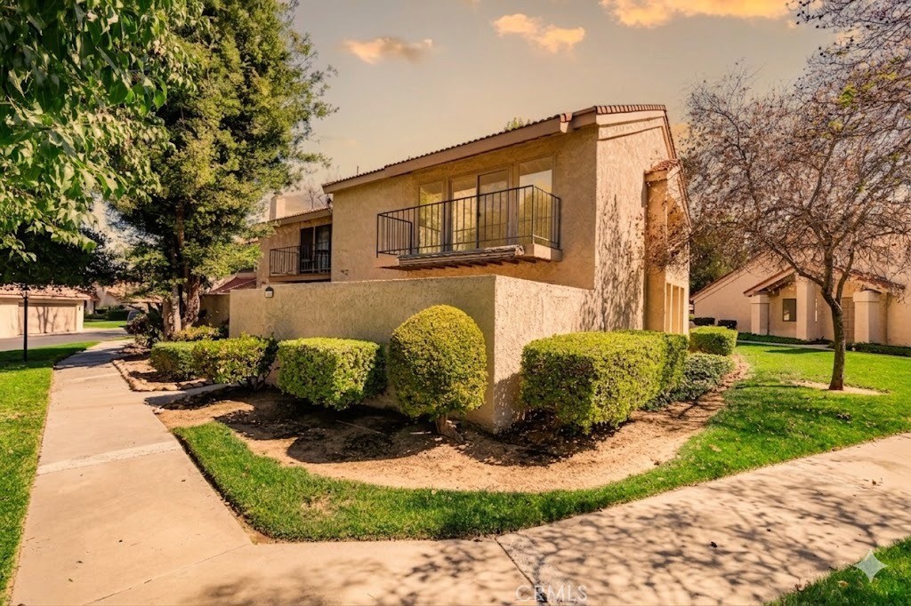 7088 Seville Way Riverside, CA 92506 - Photo 1 of 75 a front view of a house with garden