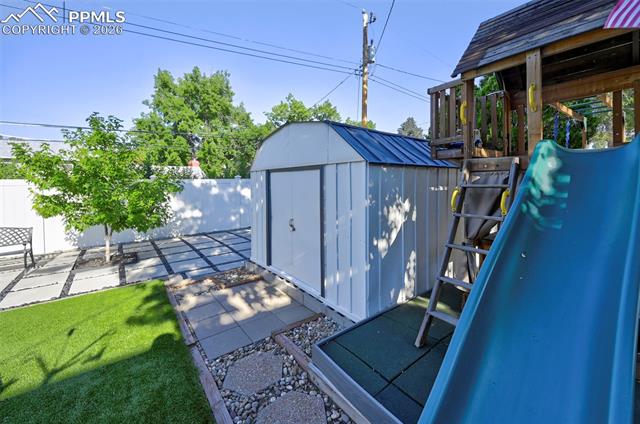 1012 North Chelton Road Colorado Springs, CO 80909 - Photo 7 of 46 View of shed with a fenced backyard