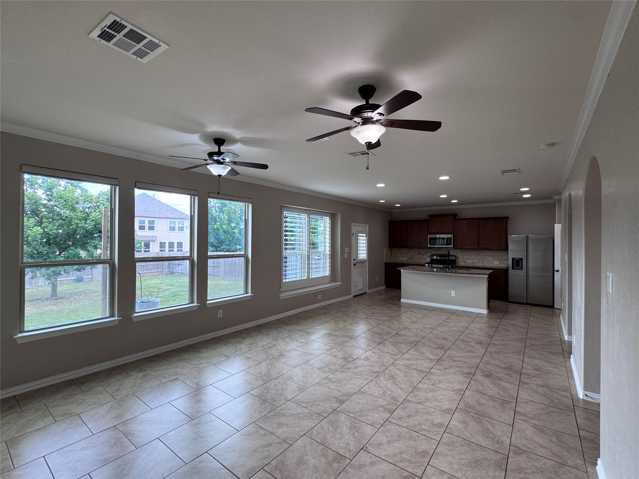 2605 Rough Berry Road Pflugerville, TX 78660 - Photo 10 of 40 An open-concept layout unites the kitchen and living spaces, perfect for gatherings.