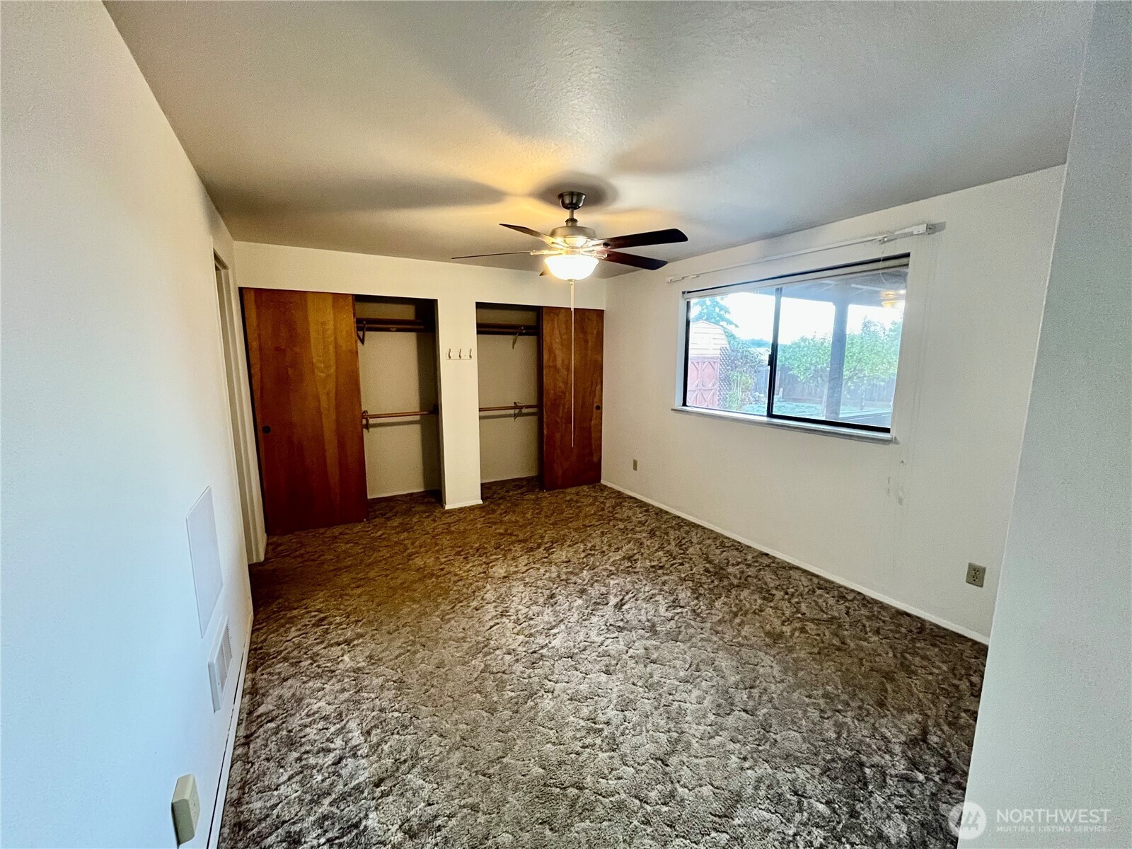 220 North Govan Avenue Sequim, WA 98382 - Photo 13 of 29 an empty room with windows and cabinet
