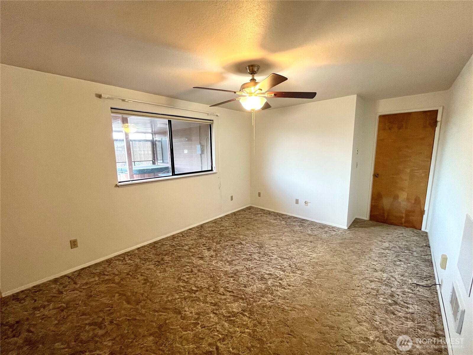 220 North Govan Avenue Sequim, WA 98382 - Photo 14 of 29 a view of a big room with chandelier fan and windows