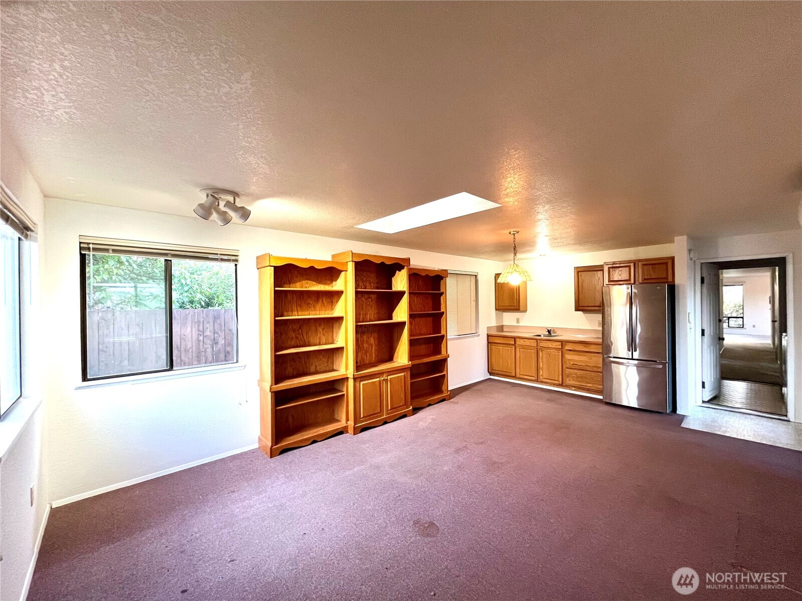 220 North Govan Avenue Sequim, WA 98382 - Photo 19 of 29 a view of an empty room with a window and cabinet