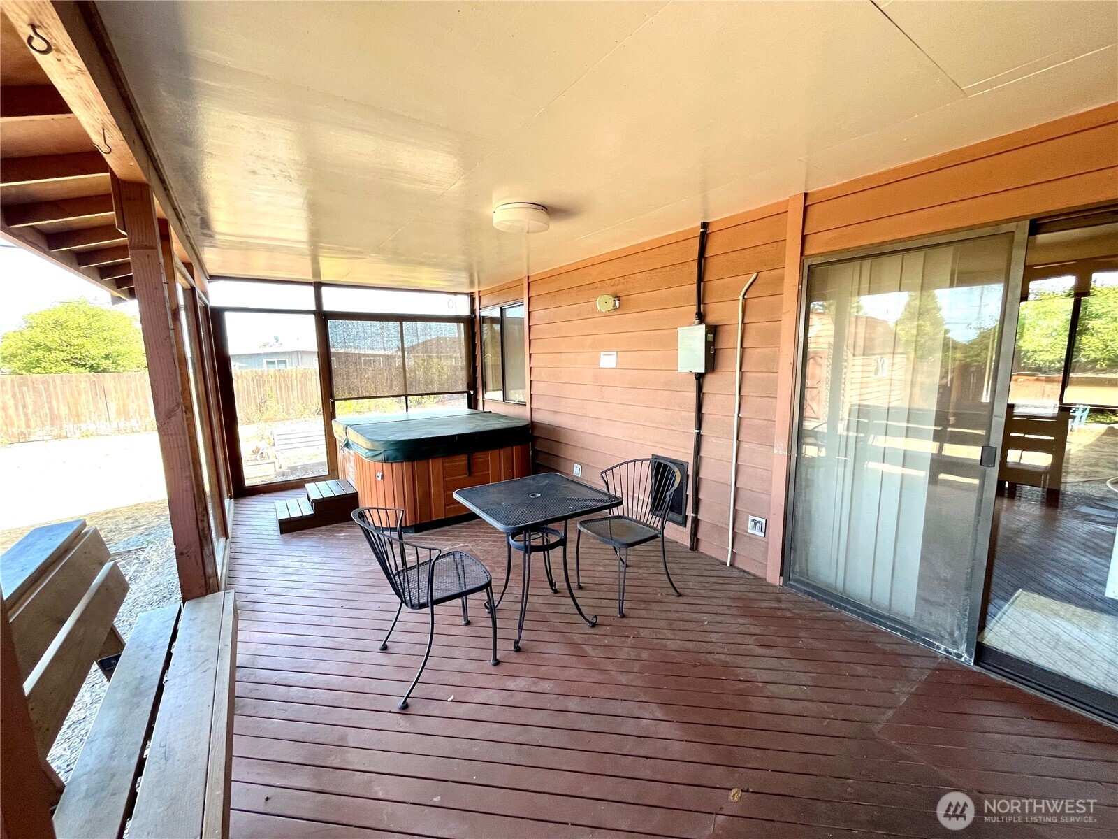 220 North Govan Avenue Sequim, WA 98382 - Photo 21 of 29 a view of a balcony with chairs and wooden floor