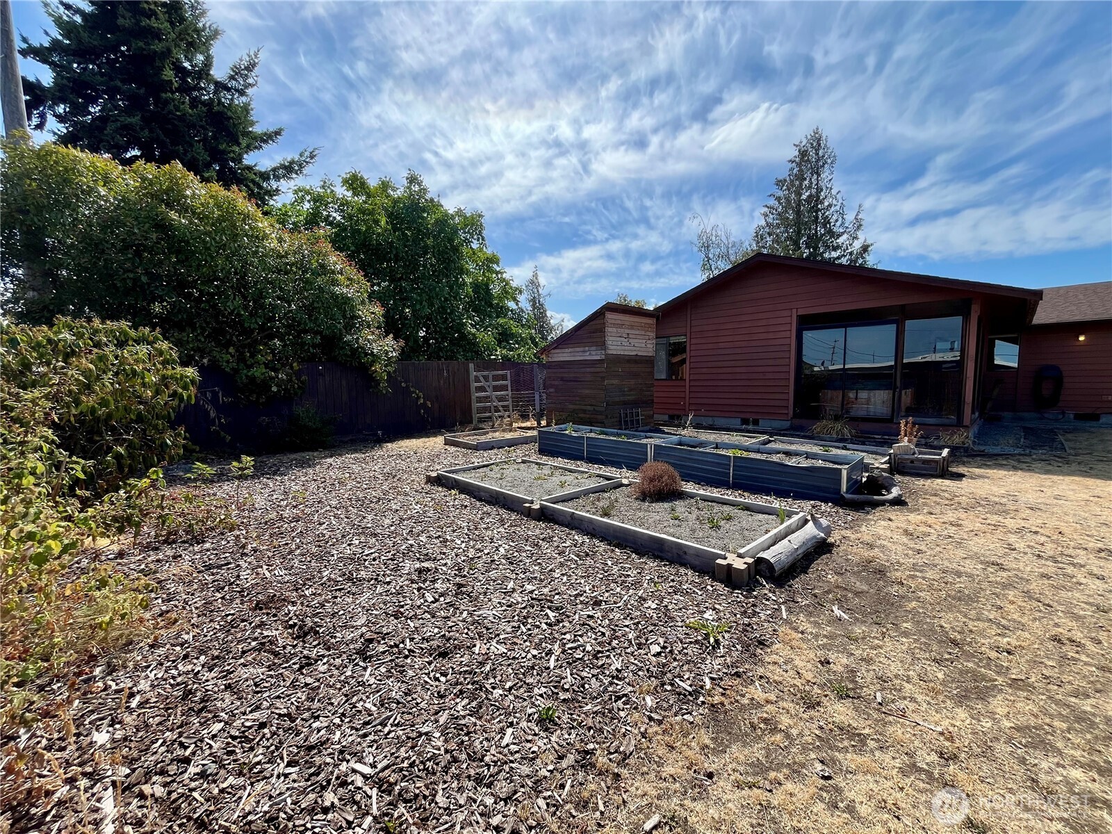 220 North Govan Avenue Sequim, WA 98382 - Photo 27 of 29 a view of backyard with a table and chairs