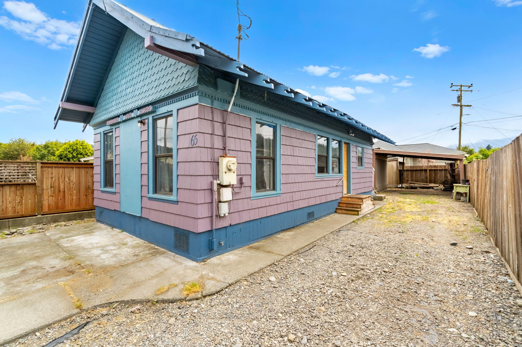 65 Davis Street Rio Dell, CA 95562 - Photo 1 of 15 a front view of a house with a yard