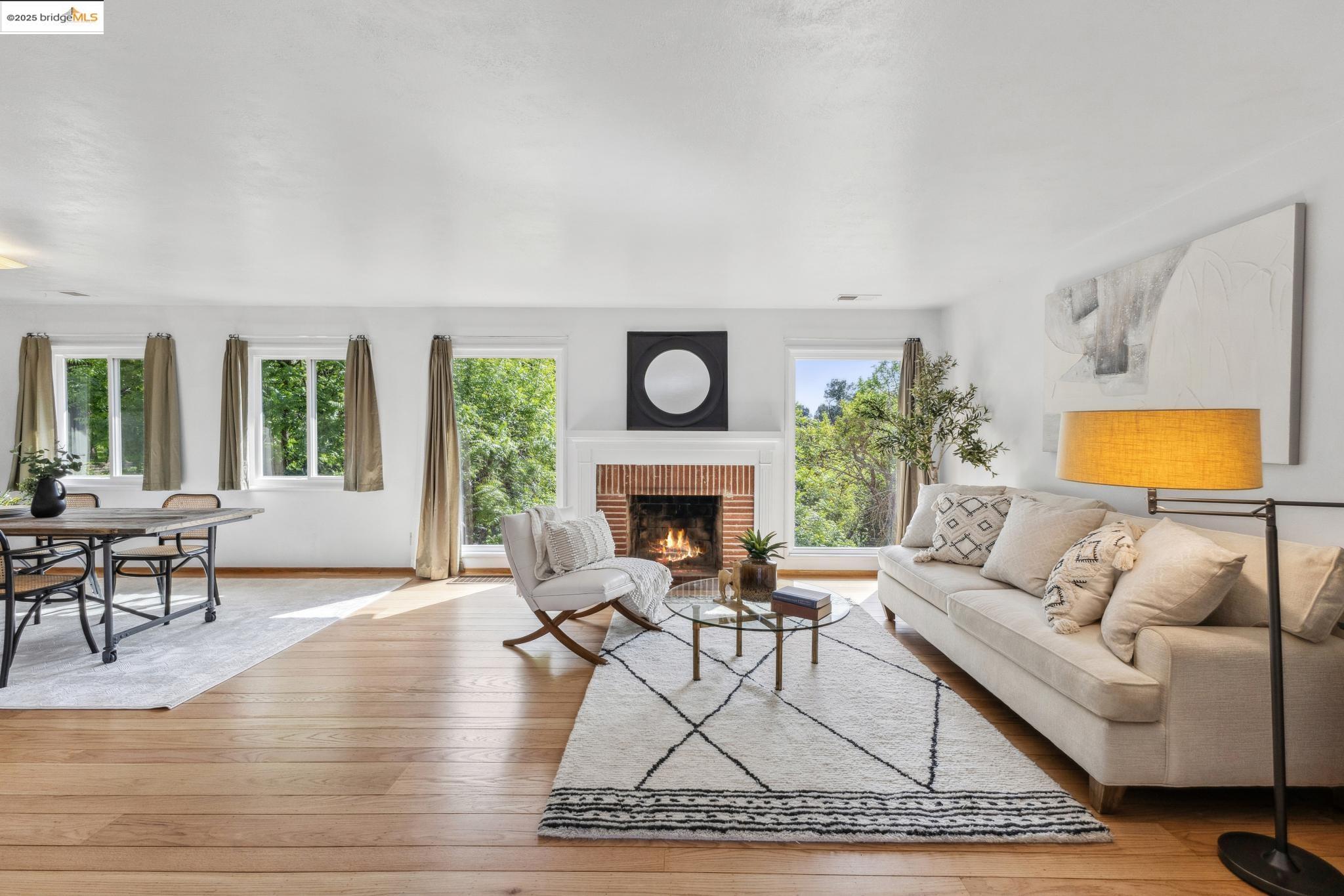 909 Mahoney Street Rodeo, CA 94572 - Photo 1 of 1 a living room with furniture a fireplace and a table