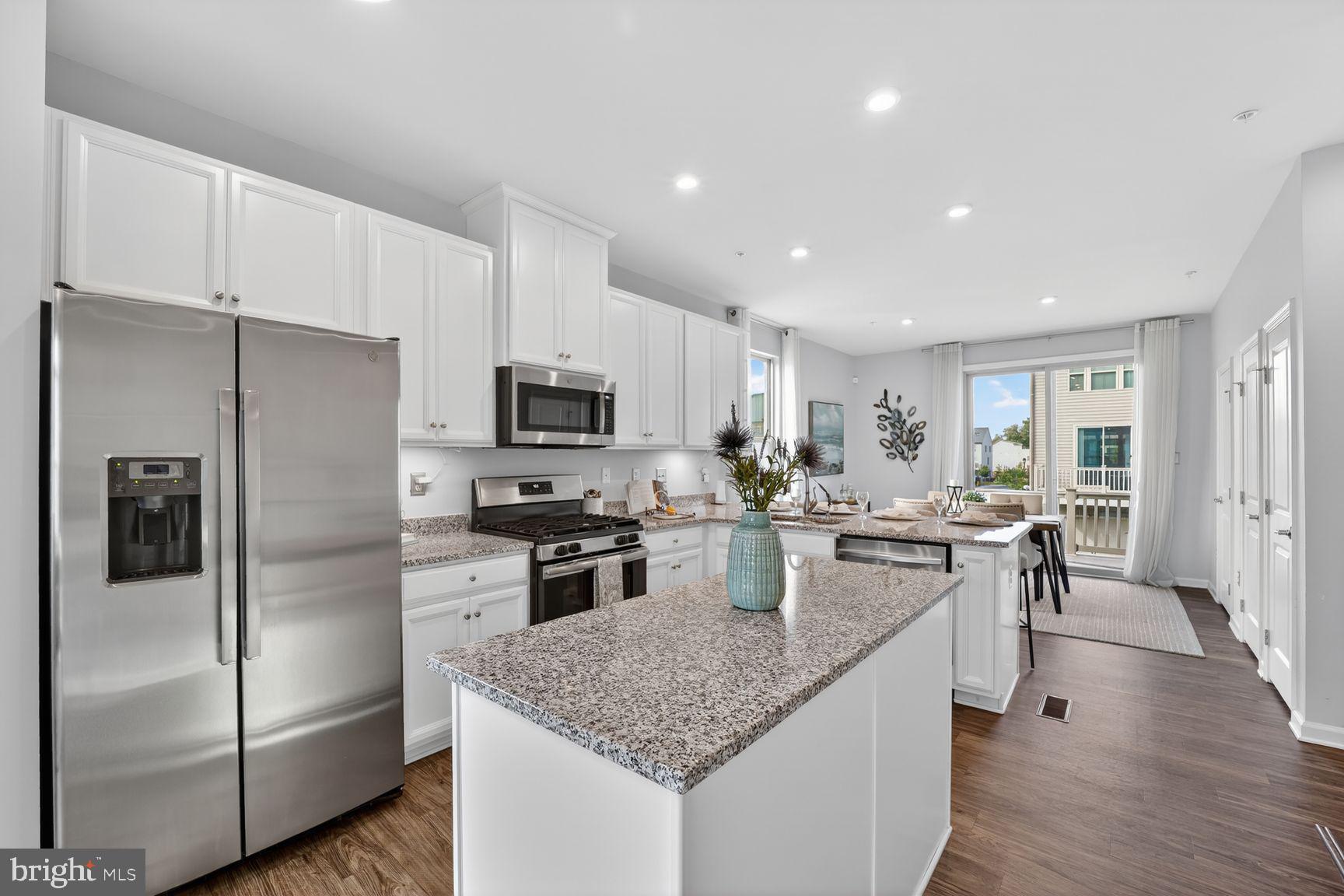 3111 Potters Hill Road Hanover, MD 21076 - Photo 6 of 40 a kitchen with refrigerator and chairs