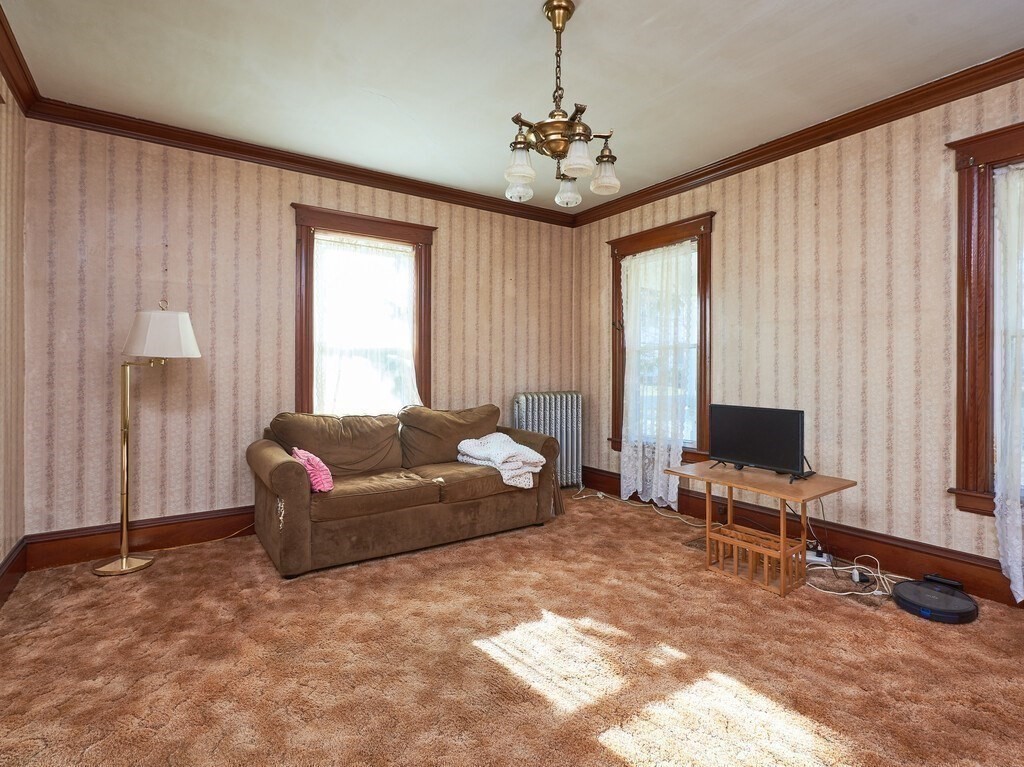 32 Wayne Street Worcester, MA 01603 - Photo 16 of 35 a living room with furniture and a flat screen tv