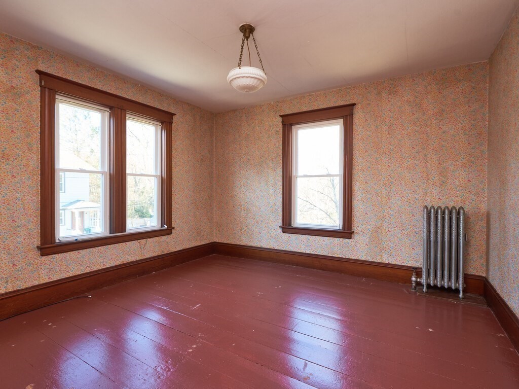 32 Wayne Street Worcester, MA 01603 - Photo 19 of 35 a view of an empty room with wooden floor and a window
