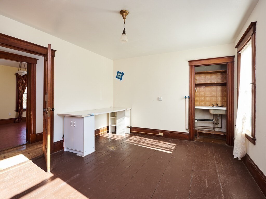32 Wayne Street Worcester, MA 01603 - Photo 23 of 35 a view of livingroom with hardwood floor and a ceiling fan