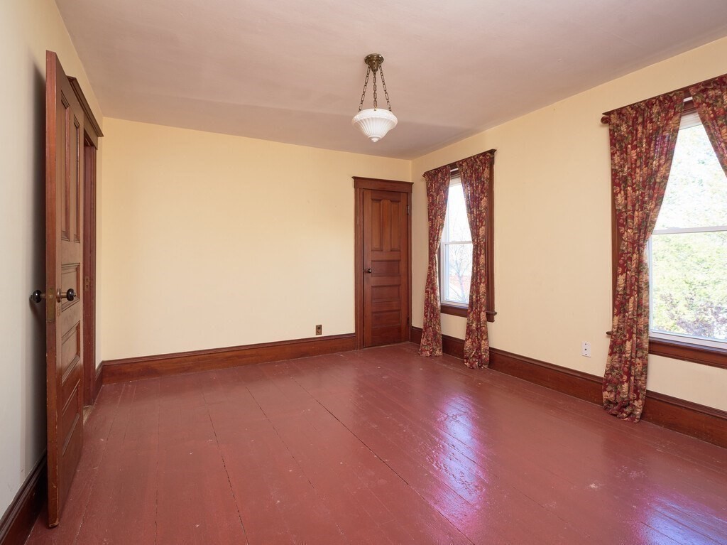 32 Wayne Street Worcester, MA 01603 - Photo 26 of 35 a view of an empty room with glass door and a window