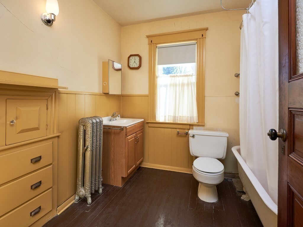 32 Wayne Street Worcester, MA 01603 - Photo 28 of 35 a bathroom with a toilet a sink and a mirror
