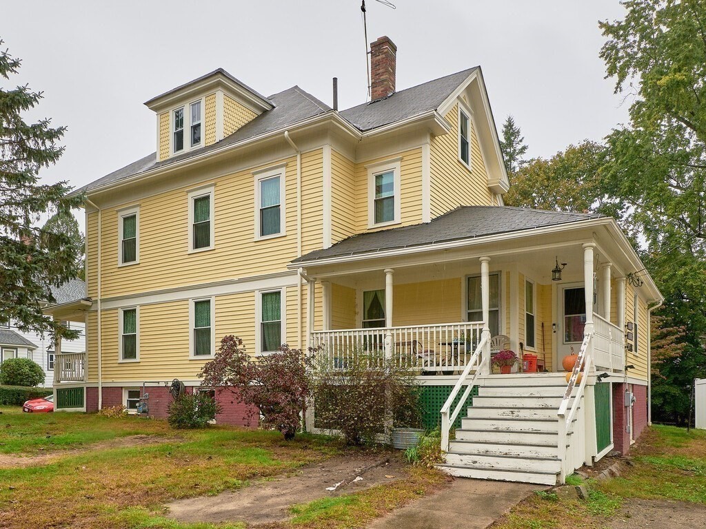 32 Wayne Street Worcester, MA 01603 - Photo 3 of 35 a front view of a house with a yard