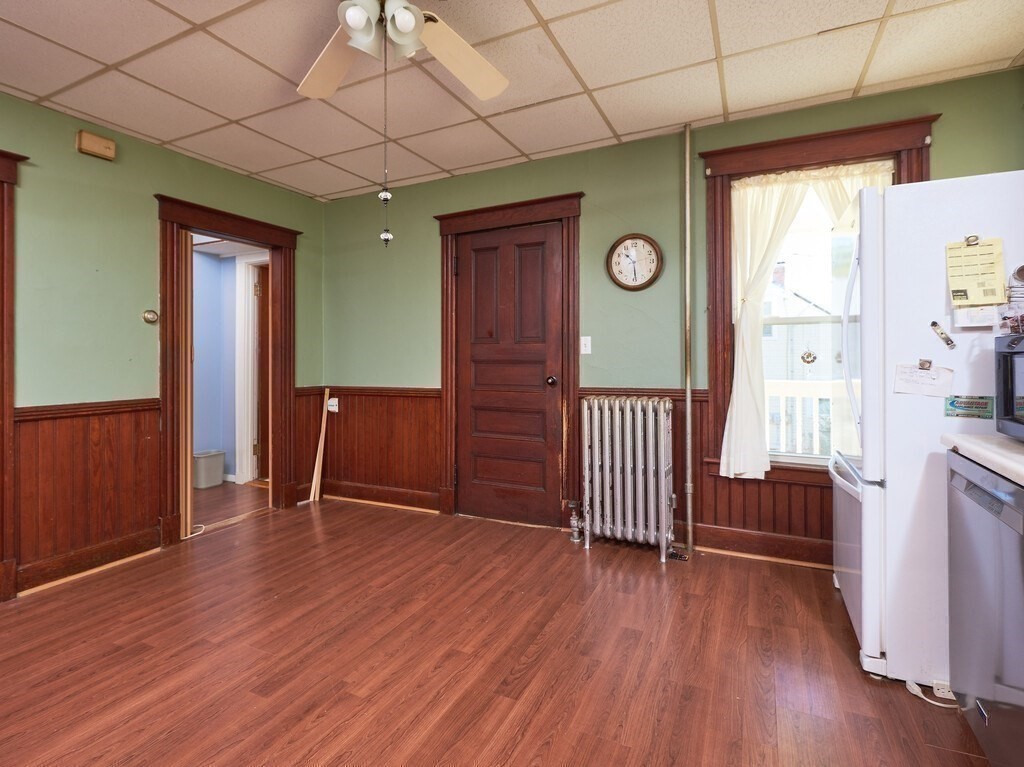 32 Wayne Street Worcester, MA 01603 - Photo 7 of 35 wooden floor in an empty room with a window