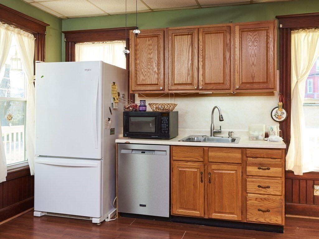 32 Wayne Street Worcester, MA 01603 - Photo 8 of 35 a white refrigerator freezer sitting in a kitchen