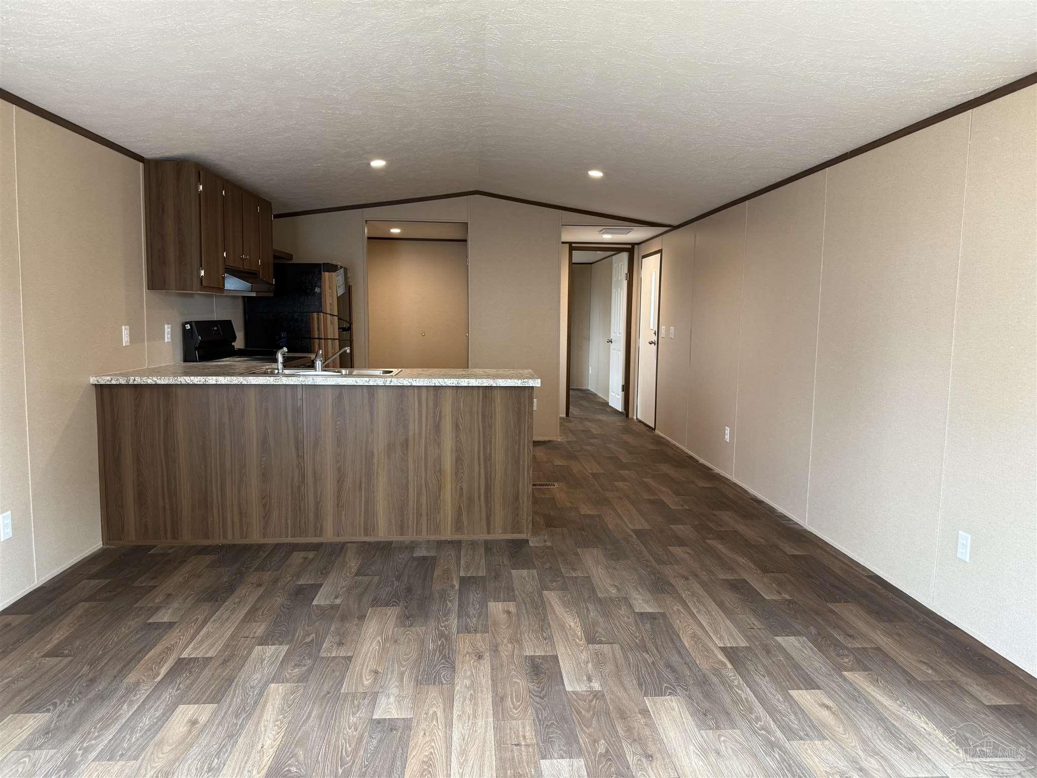 4460 Custer Lane Jay, FL 32565 - Photo 2 of 16 a view of a kitchen with wooden floor