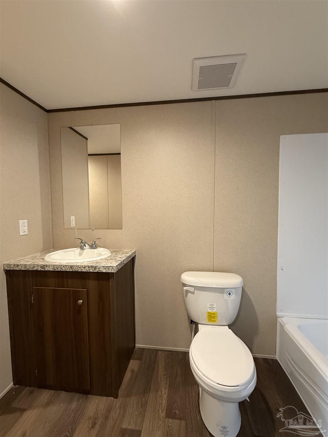 4460 Custer Lane Jay, FL 32565 - Photo 7 of 16 a bathroom with a sink and a toilet