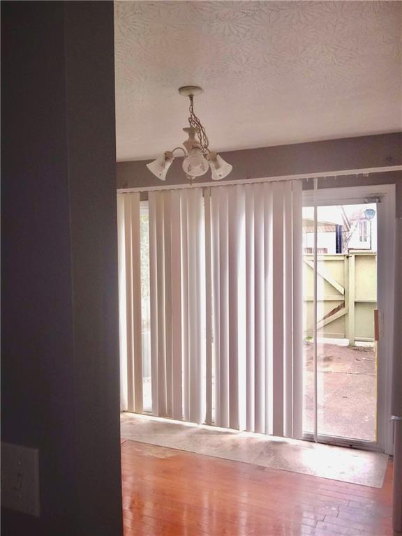 3148 Nectarine Circle Decatur, GA 30034 - Photo 8 of 10 a view of a room with wooden floor and windows