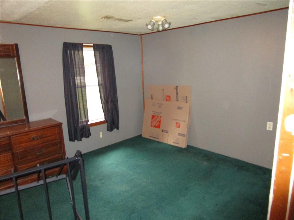 3025 South Keel Ridge Road Hermitage, PA 16148 - Photo 11 of 19 a view of an empty room with window and stairs