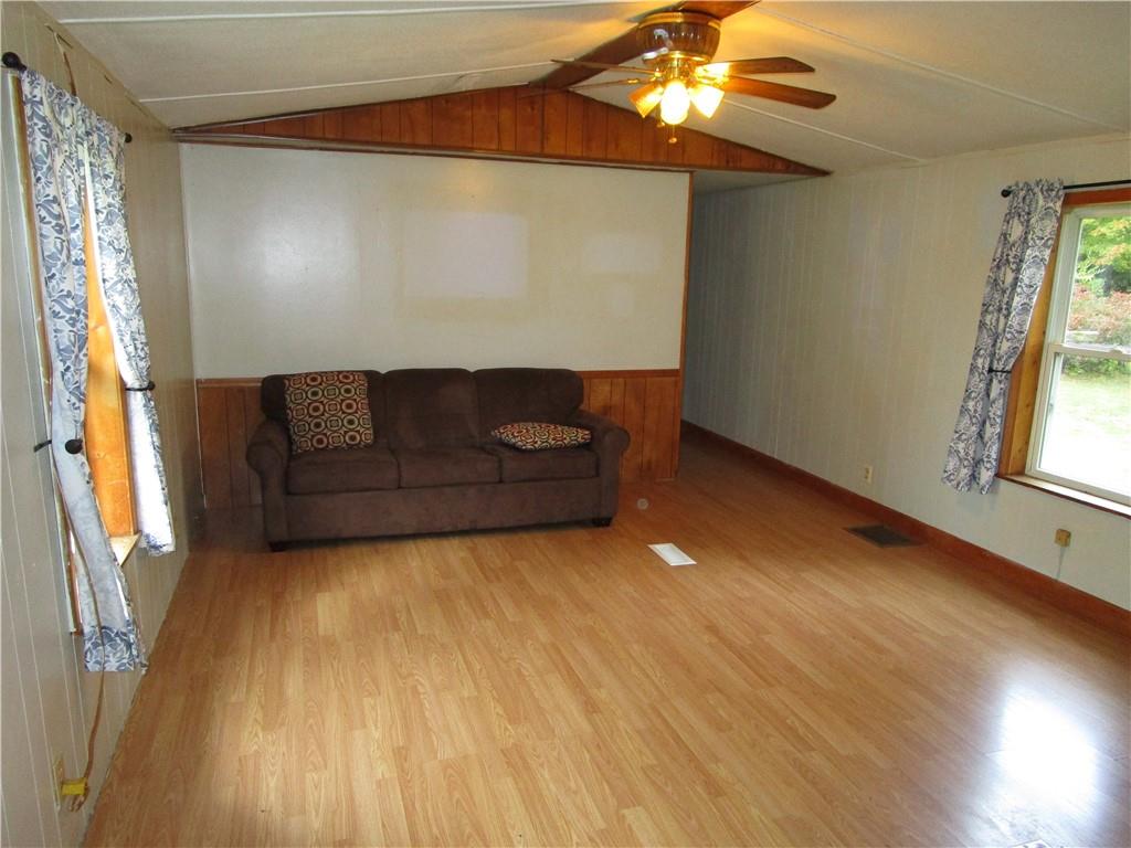 3025 South Keel Ridge Road Hermitage, PA 16148 - Photo 8 of 19 a living room with couches and painted walls next to a window