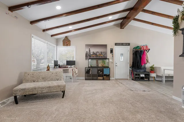 a view of dining room with furniture window and wooden floor