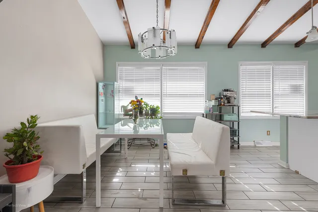 a kitchen with furniture and window