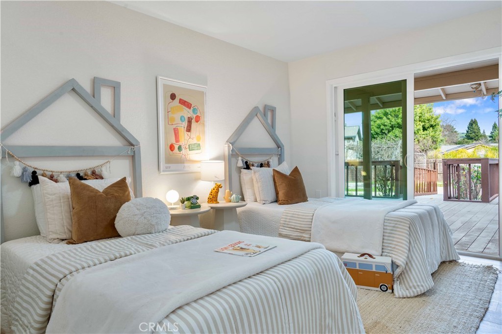 931 Camino Ramon Danville, CA 94526 - Photo 18 of 67 a bedroom with a large bed and a large window