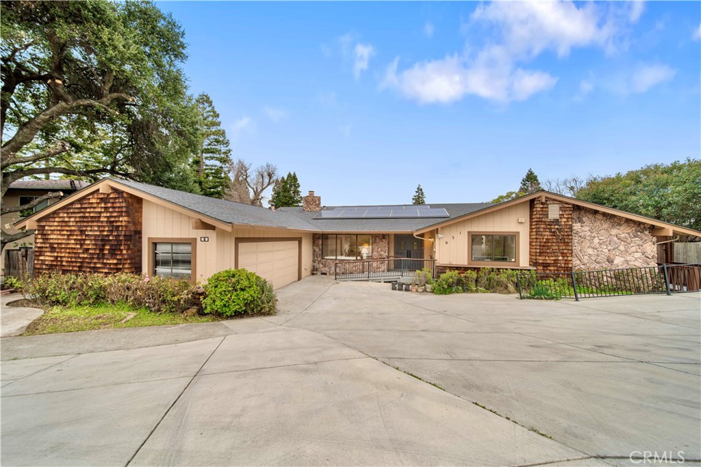 931 Camino Ramon Danville, CA 94526 - Photo 2 of 67 a front view of a house with a yard and garage