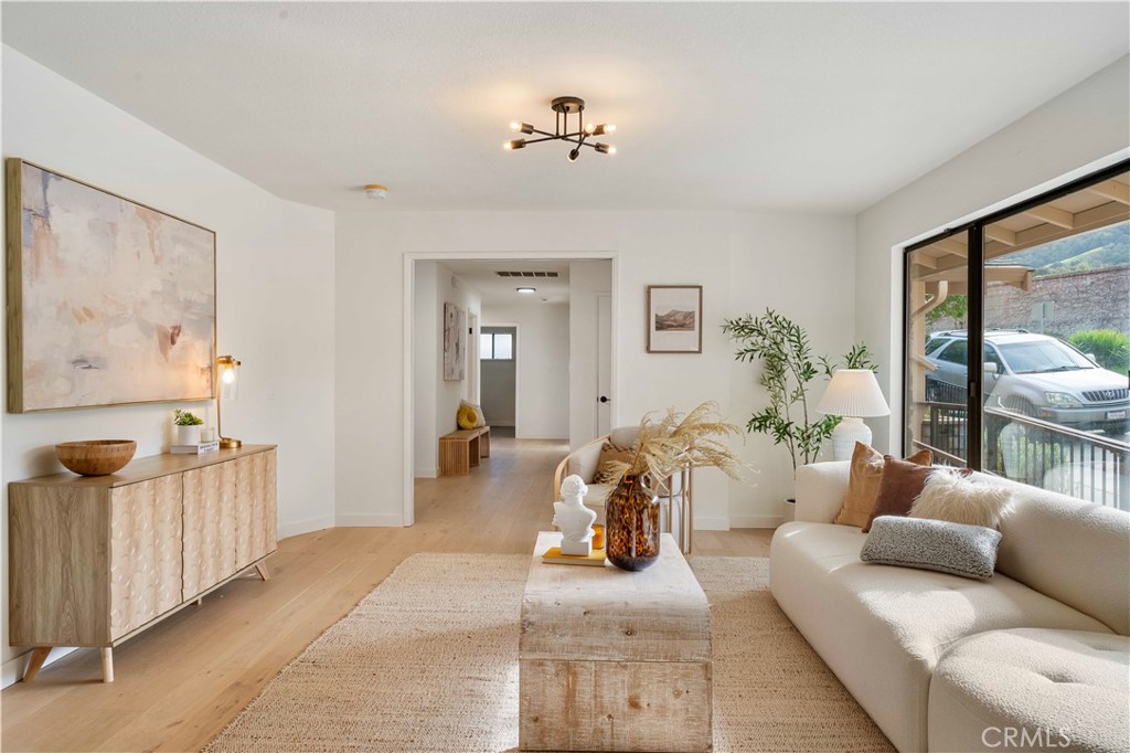 931 Camino Ramon Danville, CA 94526 - Photo 22 of 67 a living room with furniture and a chandelier