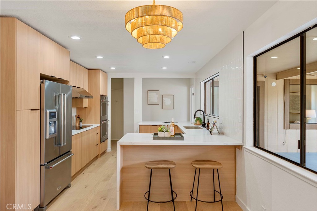 931 Camino Ramon Danville, CA 94526 - Photo 28 of 67 a kitchen with stainless steel appliances granite countertop a refrigerator and a sink