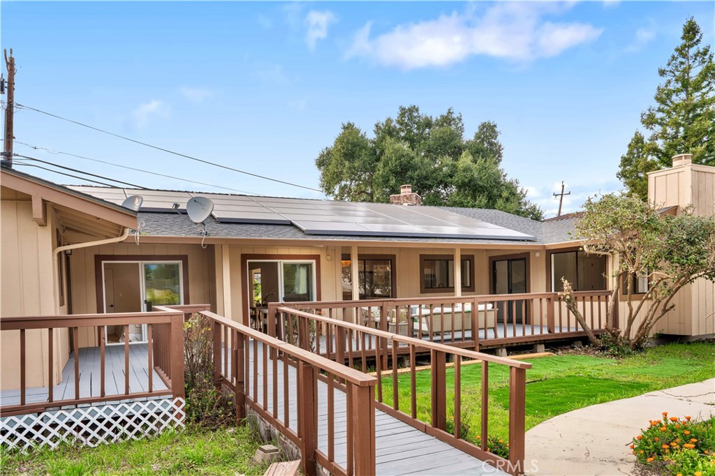931 Camino Ramon Danville, CA 94526 - Photo 57 of 67 a view of a house with a deck and a yard with wooden fence
