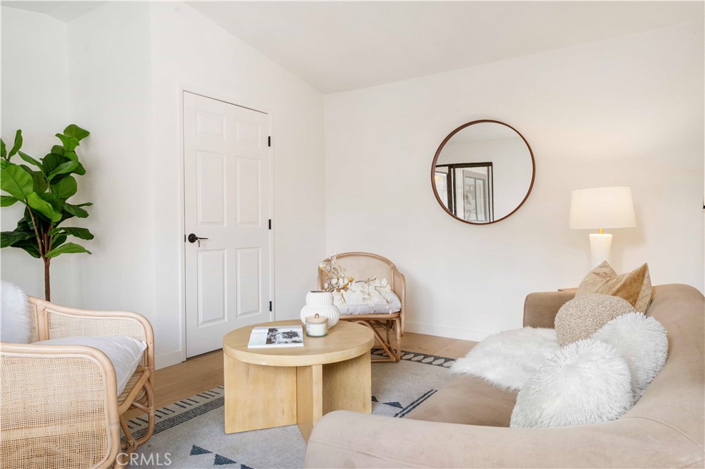 931 Camino Ramon Danville, CA 94526 - Photo 62 of 67 a living room with furniture a table and a potted plant