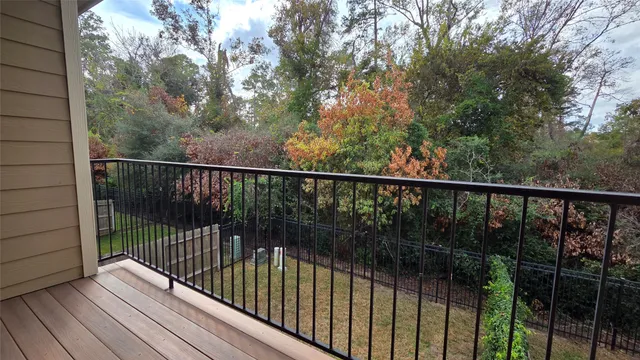a view of balcony with wooden floor