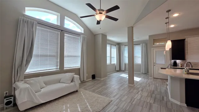 a living room with furniture and a large window