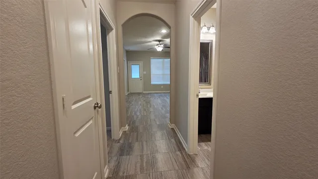 a view of a livingroom from a hallway