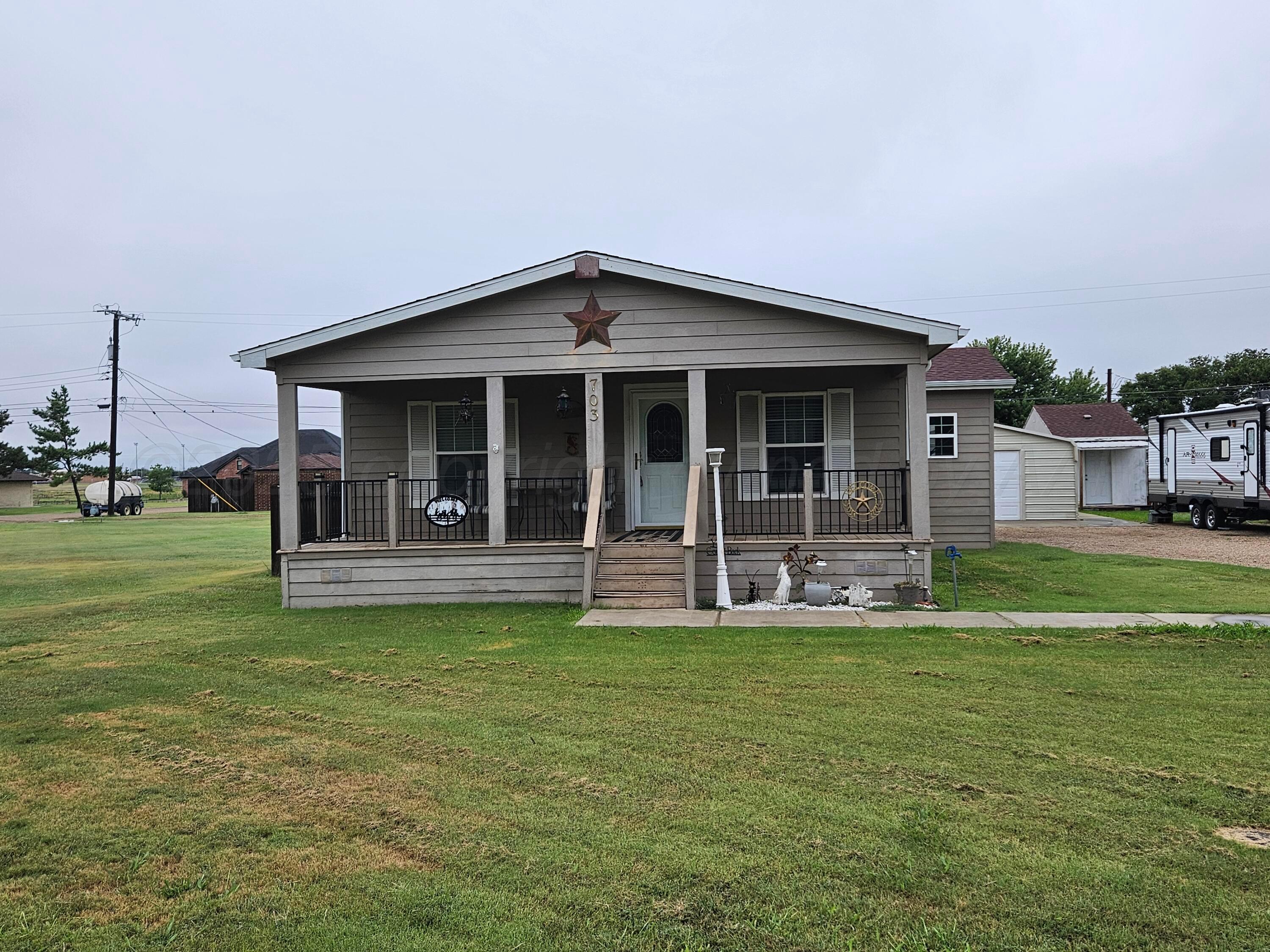 703 Martin Avenue Groom, TX 79039 - Photo 2 of 37 a view of a house with a yard and sitting area