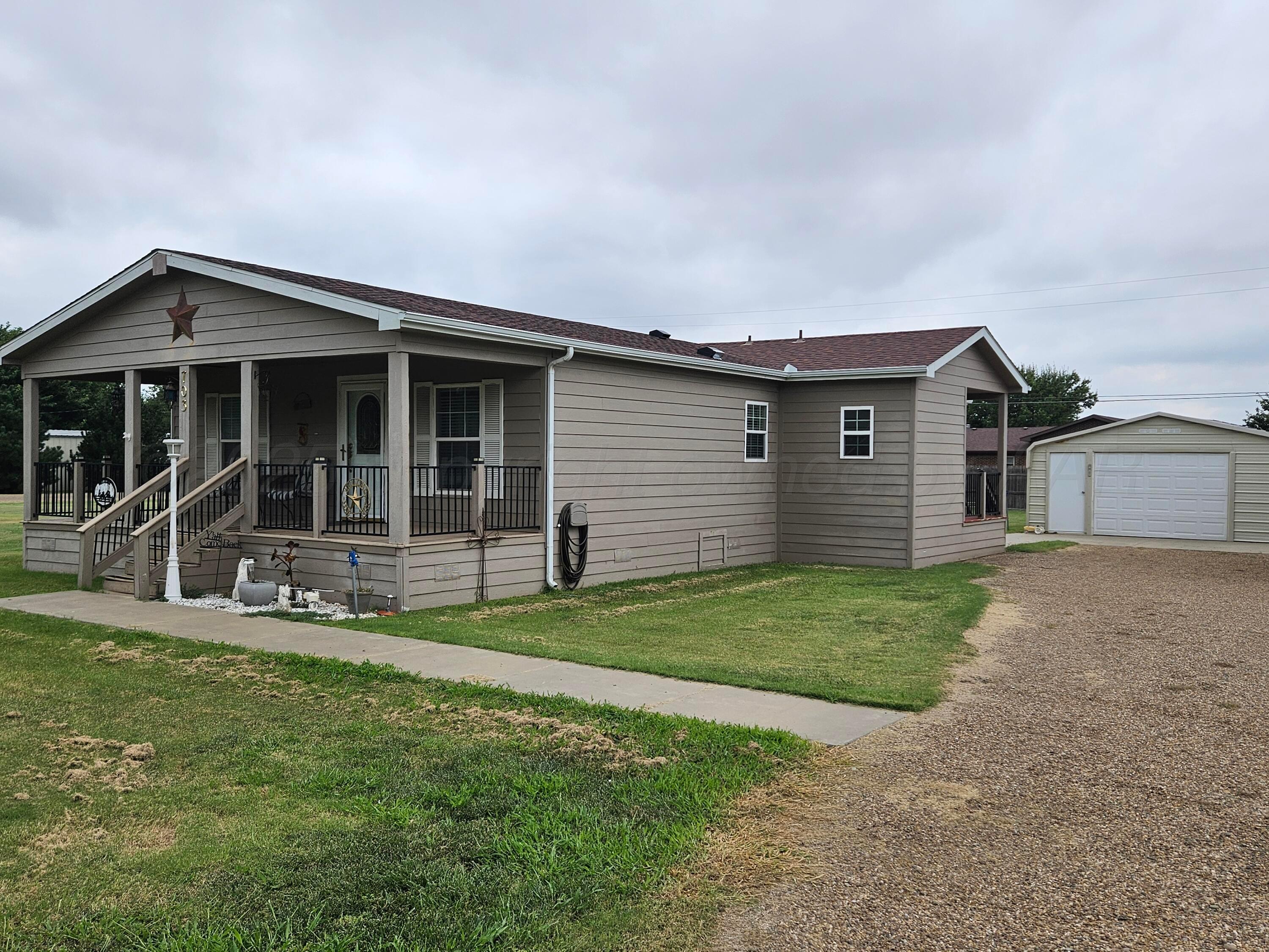 703 Martin Avenue Groom, TX 79039 - Photo 3 of 37 a view of a house with a yard and sitting area