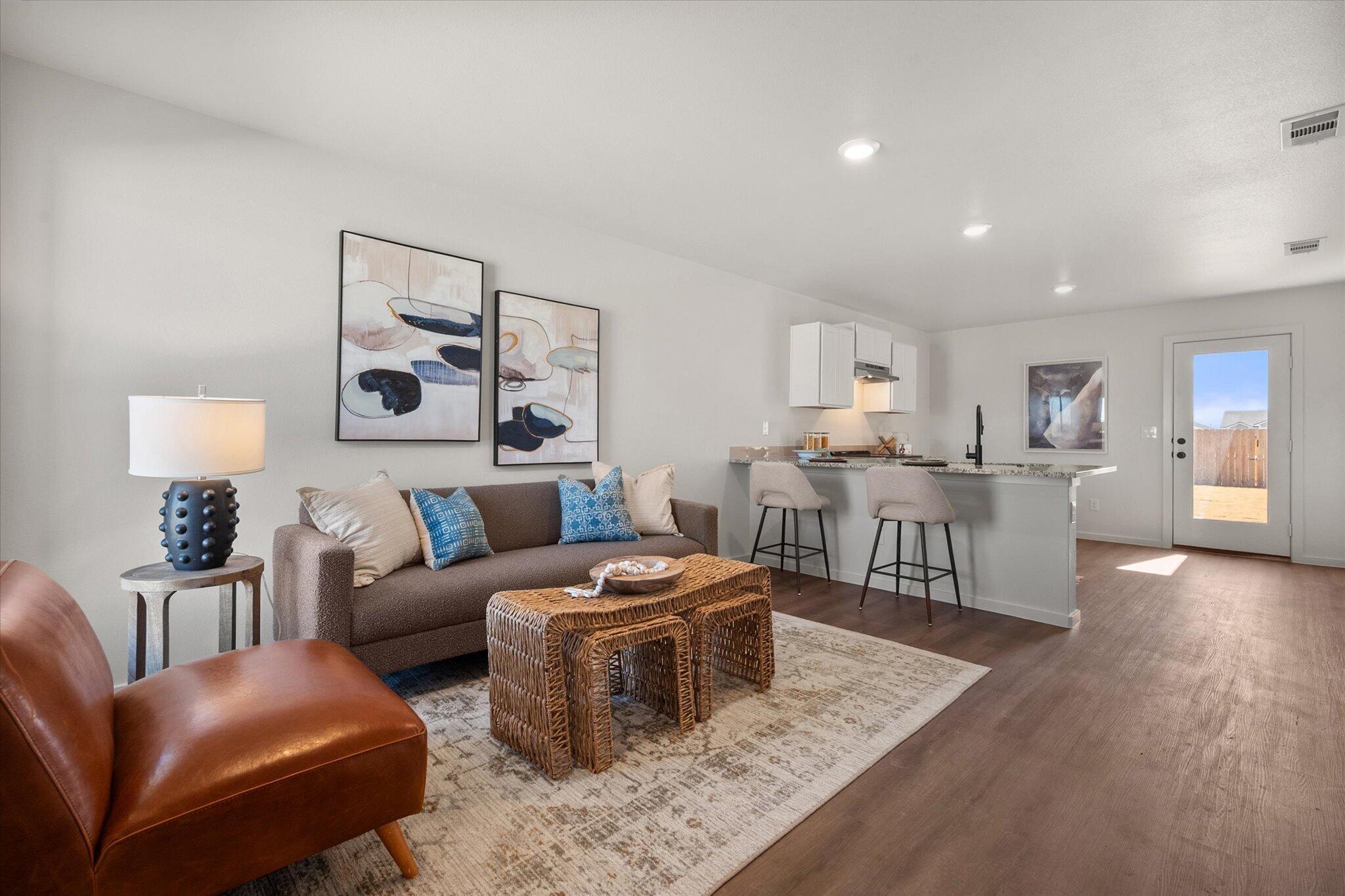 5505 Smith Street Lubbock, TX 79416 - Photo 3 of 18 a living room with furniture and a wooden floor