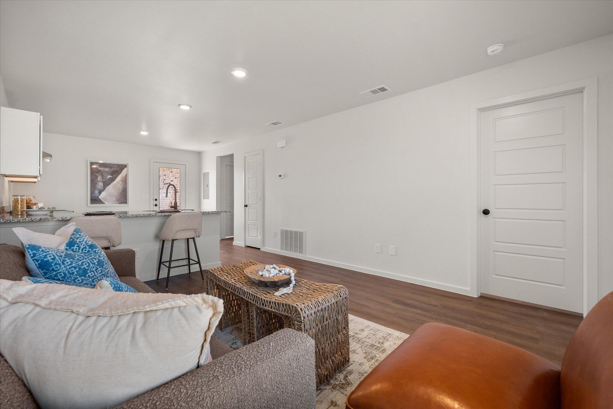 5505 Smith Street Lubbock, TX 79416 - Photo 4 of 18 a living room with furniture and a table