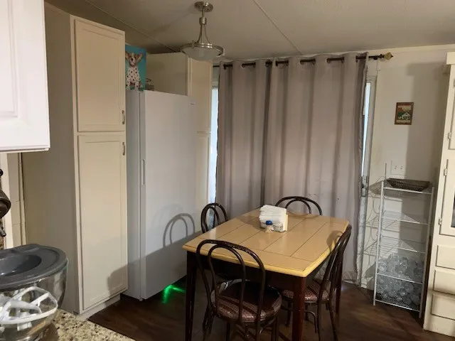 a kitchen with a sink cabinets and appliances