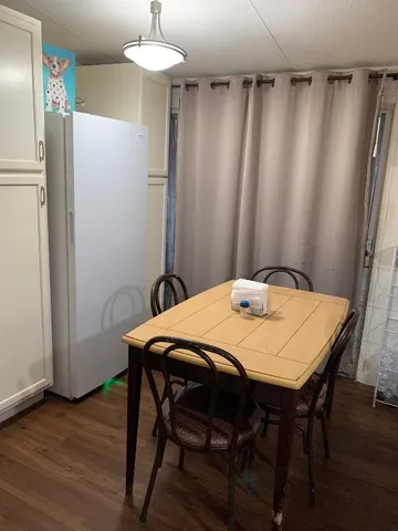 a kitchen with a cabinets and a fireplace