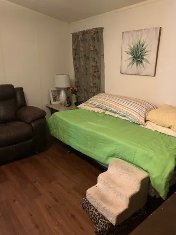 a room with furniture and a flat screen tv