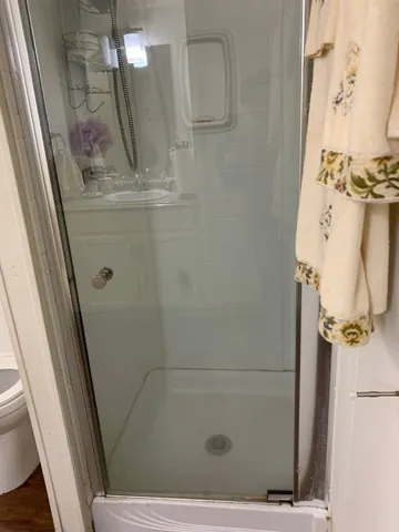 a bathroom with a granite countertop sink a mirror and vanity