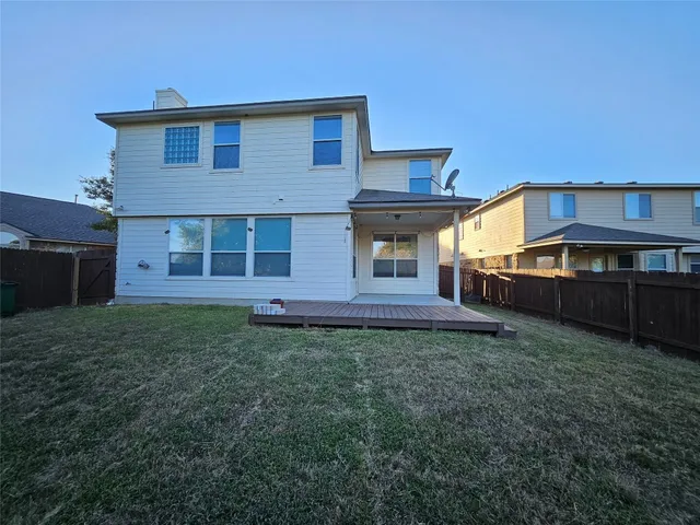a view of a house with a back yard