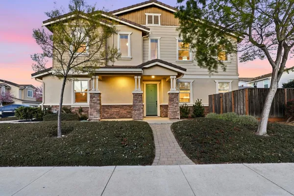 front view of a house with a yard