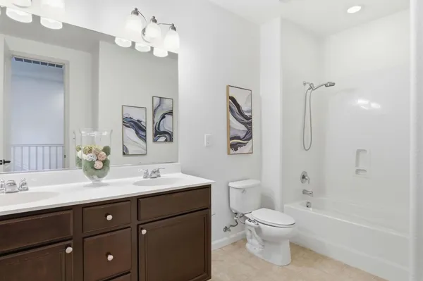 a white toilet sitting next to a white walls