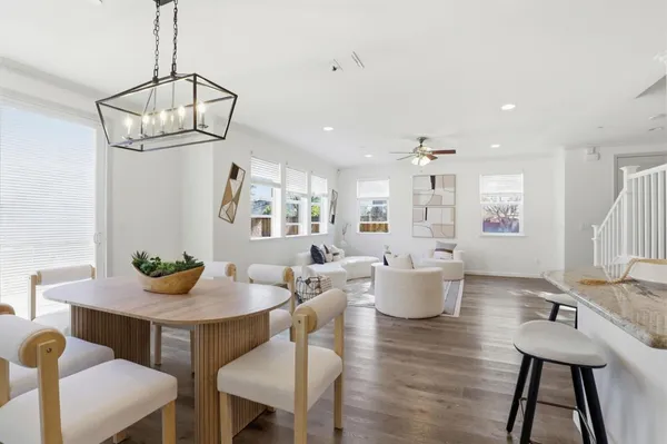 a view of a dining room with furniture window and wooden floor