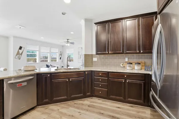 a kitchen with a sink and cabinets