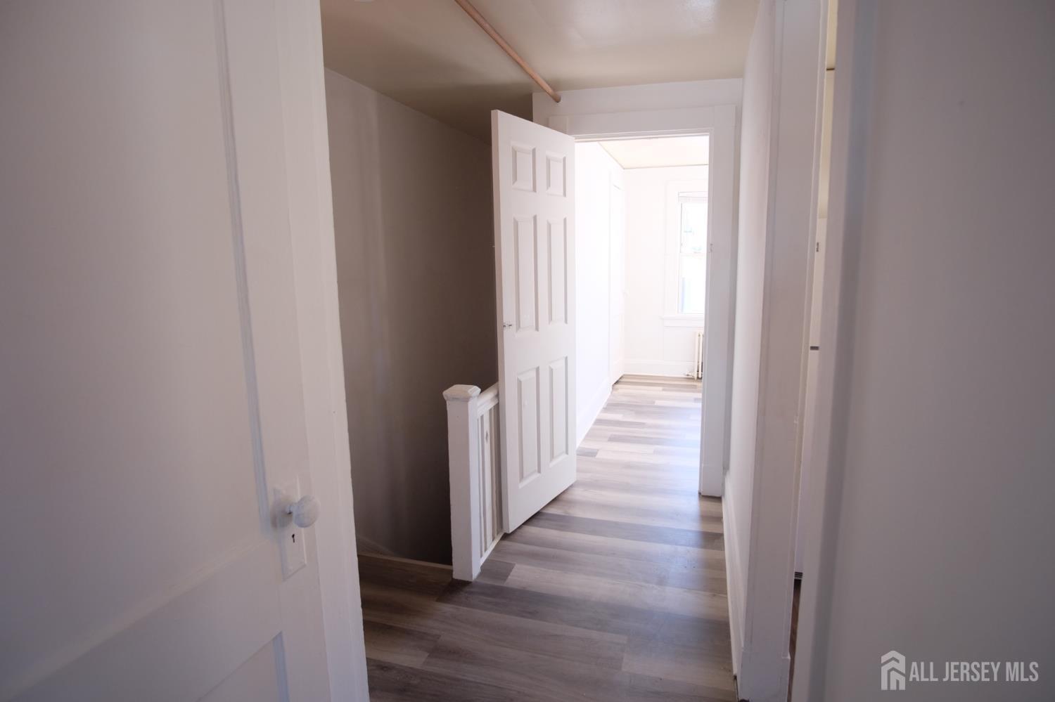 417 B Chestnut Street Middlesex, NJ 08846 - Photo 5 of 9 a view of a hallway with wooden floor