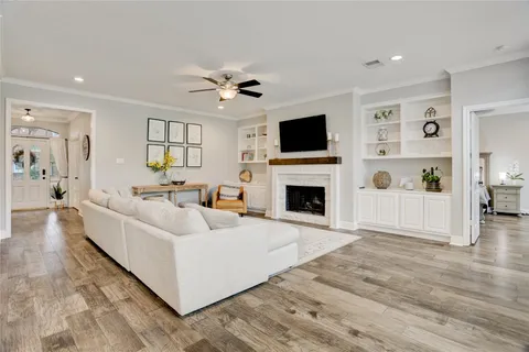a living room with furniture and kitchen view